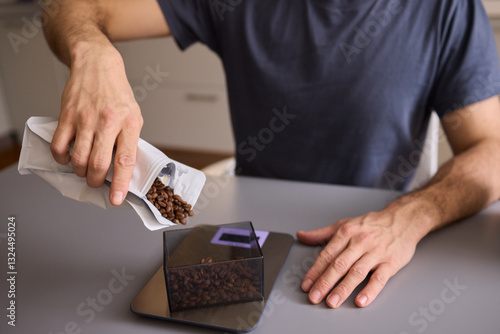 Pouring Coffee Beans into a Container for your brewing process each morning is essential