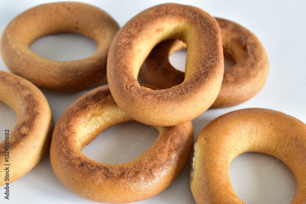 Bagels are piled up on the table. Close-up.
