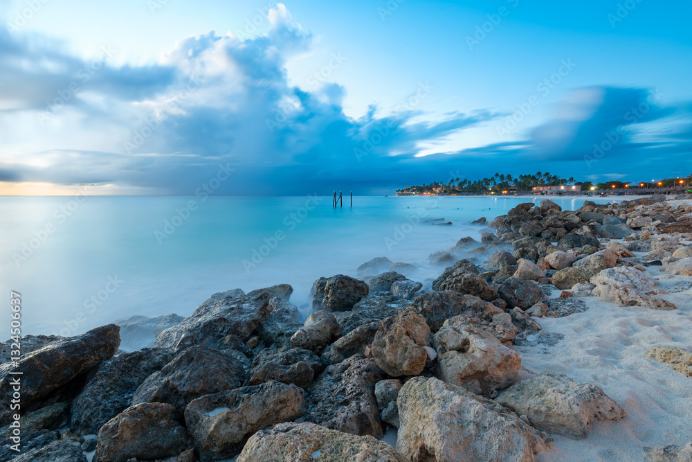 Divi Beach in Aruba features soft sands and gentle waves at dusk. Visitors can enjoy serene moments while soaking in the tropical atmosphere and stunning natural beauty. Divi Beach in Aruba features soft sands and gentle waves at dusk. Visitors can enjoy serene moments while soaking in the tropical atmosphere and stunning natural beauty.