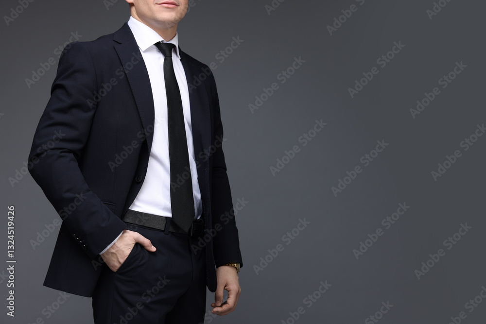 Man in classic suit on grey background, closeup. Space for text Man in classic suit on grey background, closeup. Space for text
