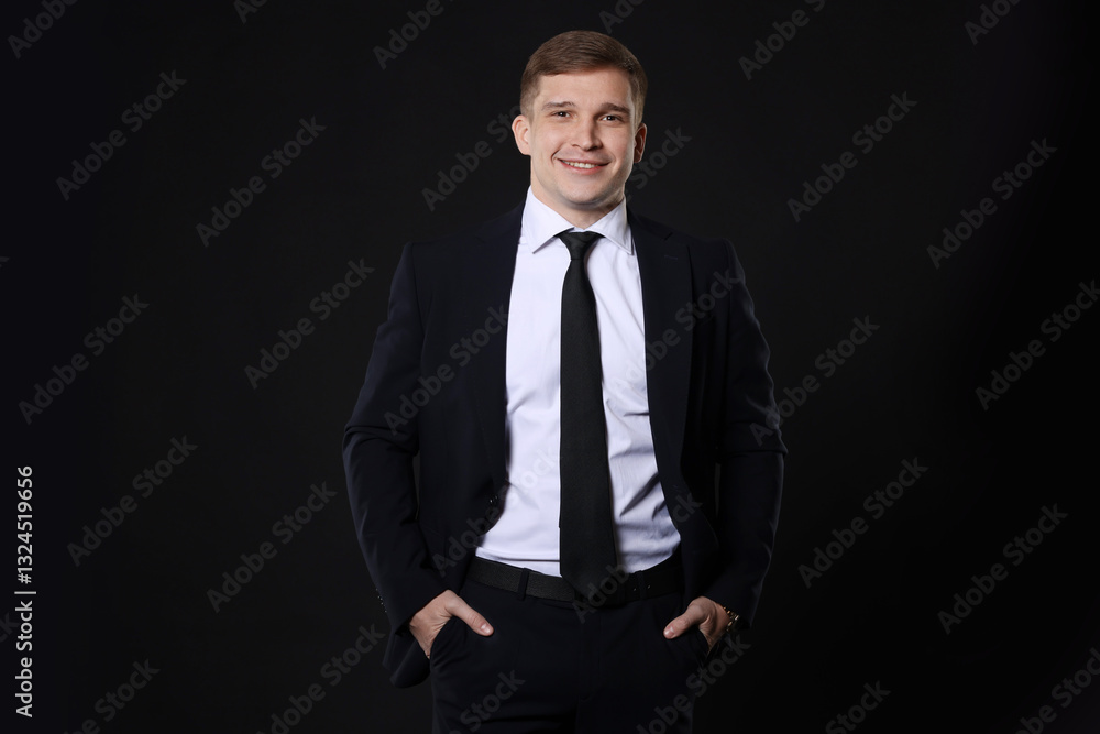 Man in classic suit on black background Man in classic suit on black background