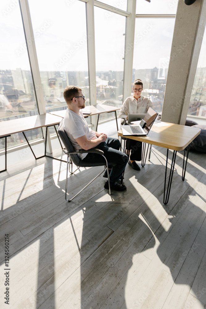 Two office workers working to together Two office workers working to together