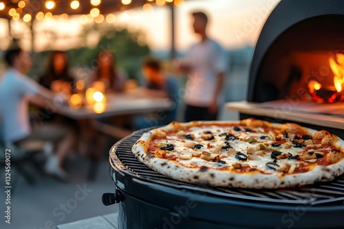 Pizza and Grill: a delicious pizza is cooking on a barbecue grill, a group of people gather for dinner outside.
