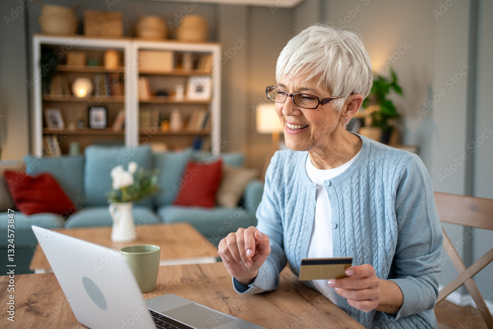 Happy senior woman using laptop and credit card for online shopping at home Happy senior woman using laptop and credit card for online shopping at home