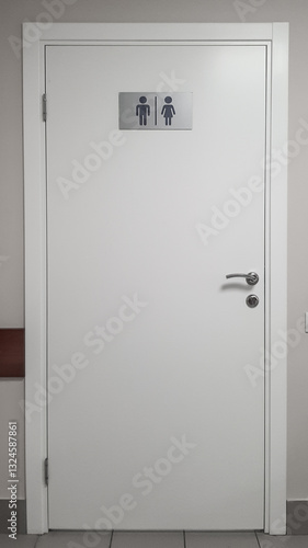 the door of a modern toilet in a public place with convenient and understandable designations