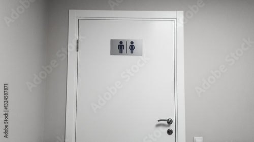 the door of a modern toilet in a public place with convenient and understandable designations
