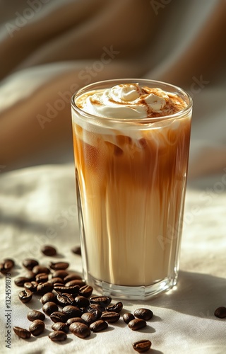 Delicious Iced Coffee Topped With Whipped Cream and Cinnamon Served in a Tall...