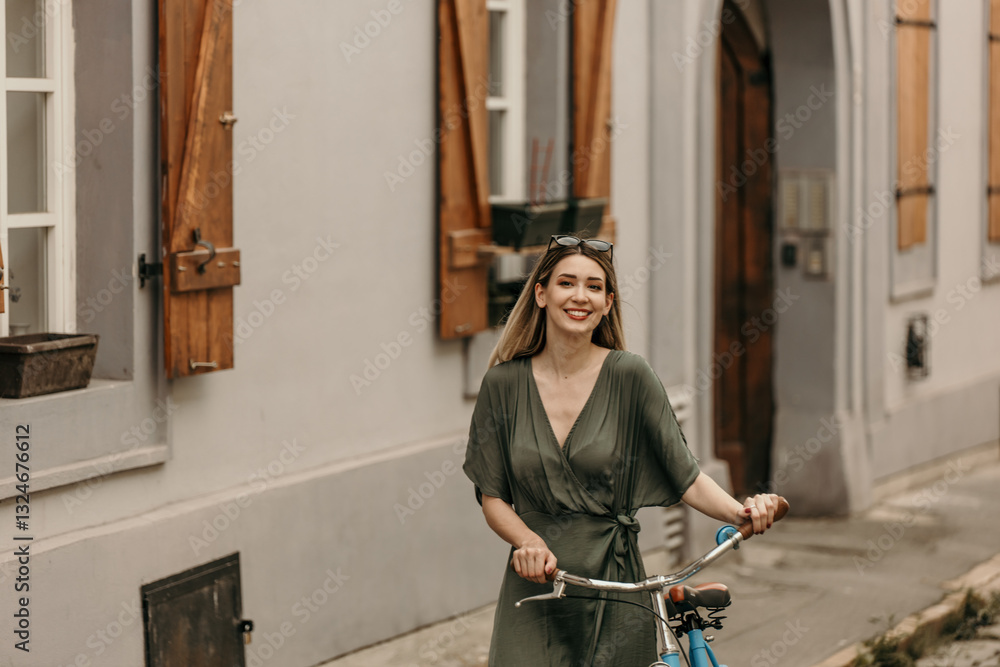 A beautiful young woman pushing her bicycle and exploring the city on a summer day. Copy space A beautiful young woman pushing her bicycle and exploring the city on a summer day. Copy space