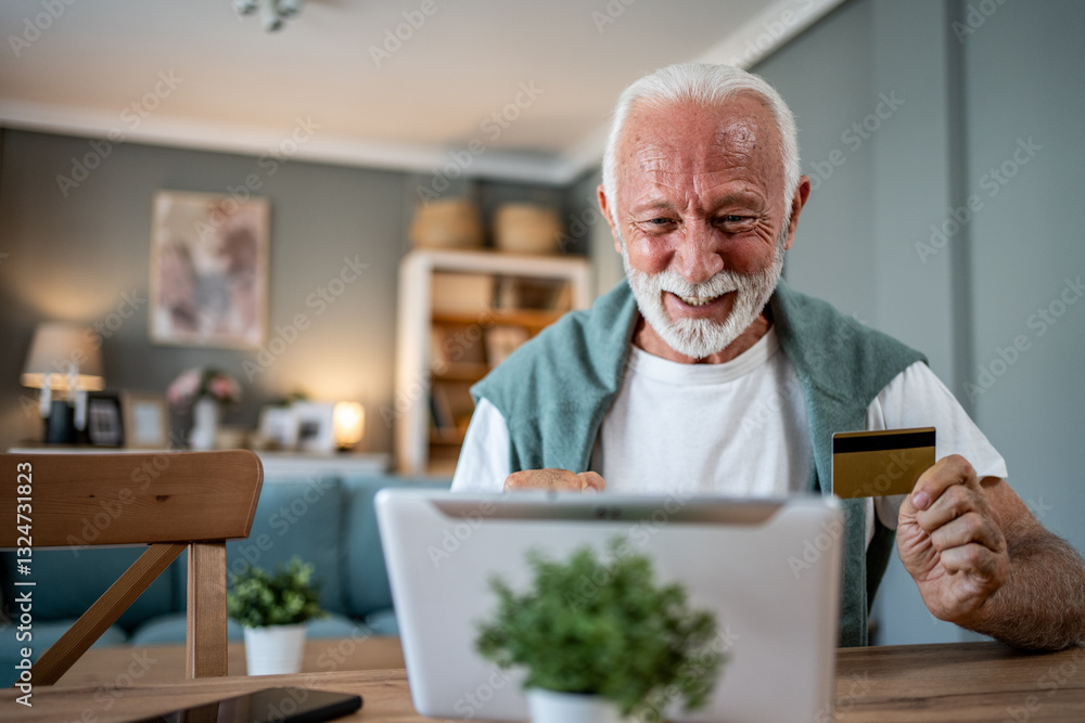 Happy senior man using tablet and credit card for online shopping at home Happy senior man using tablet and credit card for online shopping at home