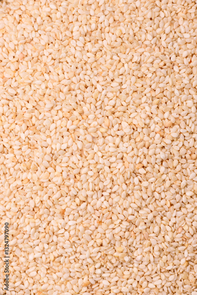 White sesame seeds in a bowl, an ingredient for making vegetarian food White sesame seeds in a bowl, an ingredient for making vegetarian food