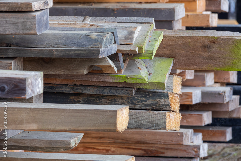 Weathered wood planks of varied shapes and colors, creating a rich texture for backgrounds Weathered wood planks of varied shapes and colors, creating a rich texture for backgrounds