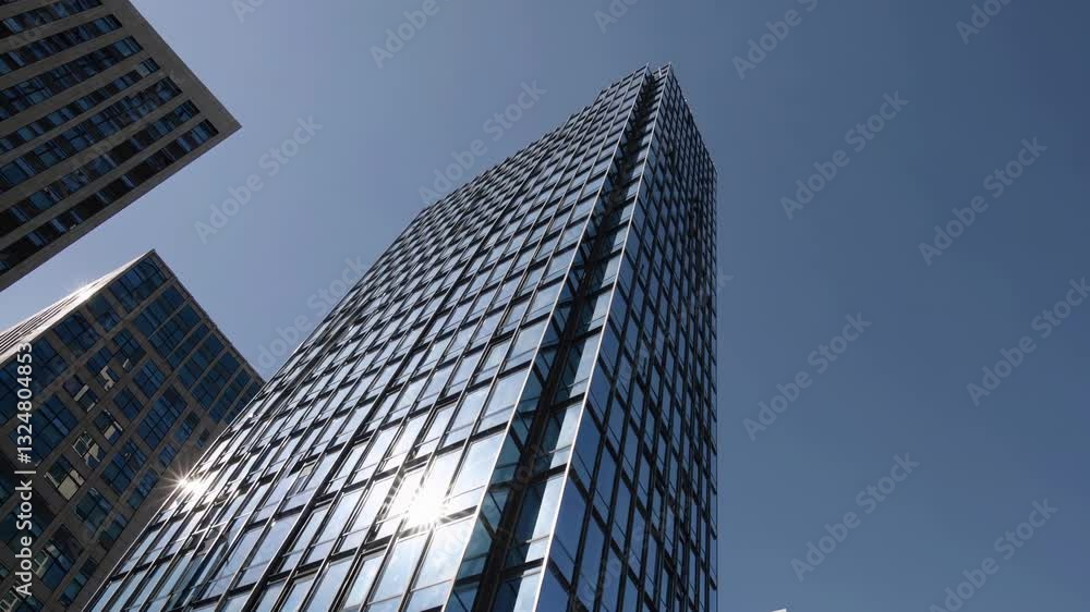 Sunlight reflecting on modern skyscraper facade Sunlight reflecting on modern skyscraper facade