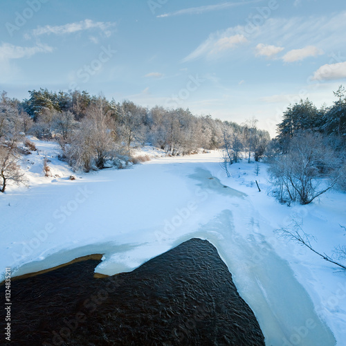 Beautiful evening  calm  view of winter river from bridge