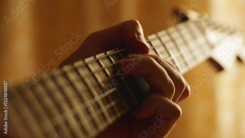 Beautiful closeup of electric guitar playing and neck fretboard