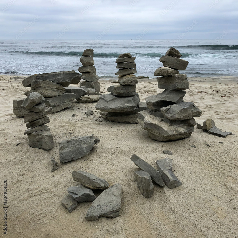 A cairn of stacked stones marking a zen moment on the sandy beaches of California.