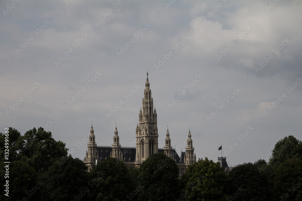 The stunning Vienna City Hall (Rathaus) stands tall in the heart of the city, showcasing its neo-Gothic architecture and intricate façade The stunning Vienna City Hall (Rathaus) stands tall in the heart of the city, showcasing its neo-Gothic architecture and intricate façade