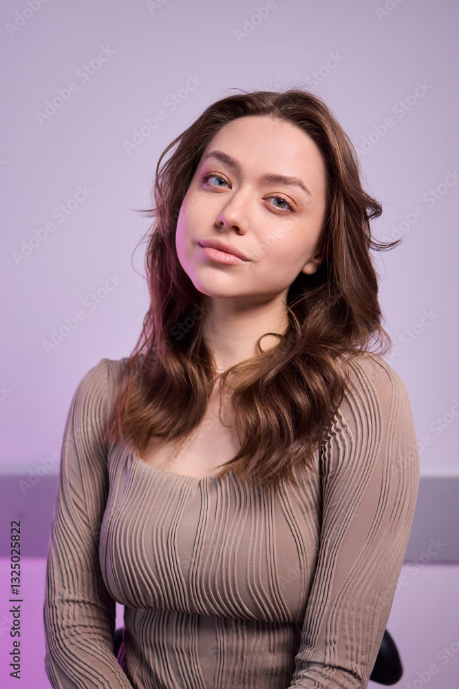 Fototapeta premium Stylish Young Woman Captured in a Modern Office Setting, Exuding Charm and Confidence