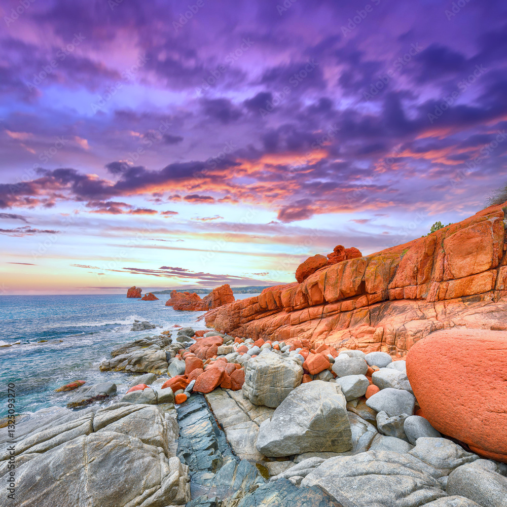 Remarkable sunset view of Red Rocks (is Scoglius Arrubius) on Cea beach