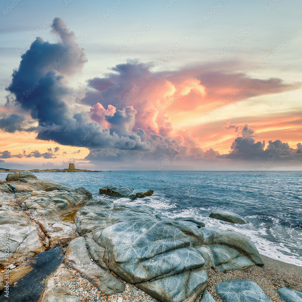 Exciting sunset view of Bari Sardo tower in the Gulf of Orosei.