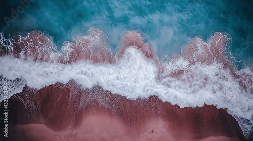 Aerial view shows ocean waves meeting a sandy beach shoreline