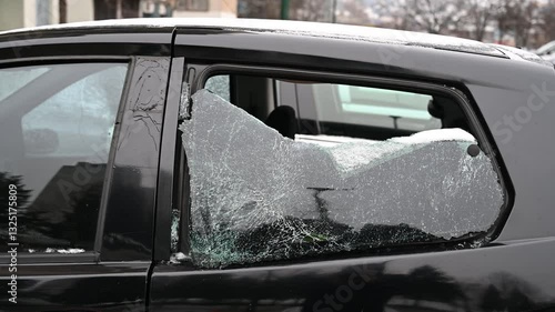 Broken car window. Broken rear car window. Burglary and theft from vehicles. Vandalism. Smashed glass.
