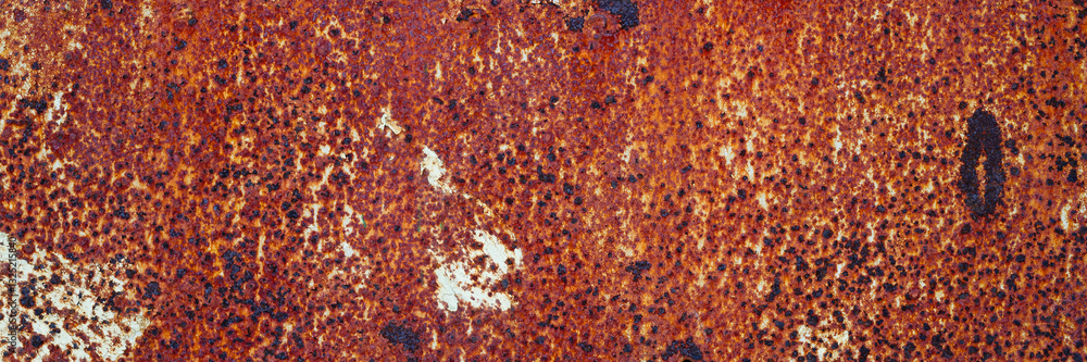 Old rusty metal texture. Rust on the surface of the iron wall. Panoramic background for grunge design.