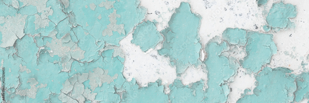 Green peeling paint on the wall. Old concrete wall with cracked flaking paint. Weathered rough painted surface with patterns of cracks and peeling. High resolution texture for background and design.