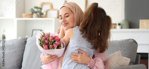 Little girl hugging her Mus...