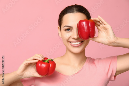 Pretty young woman holding ...