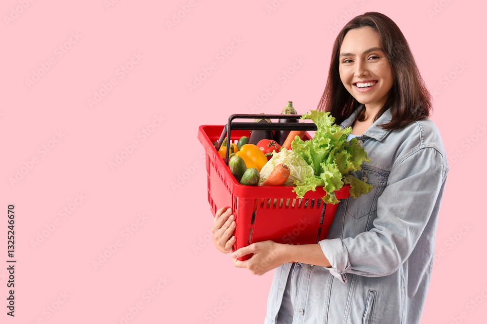 Young woman with shopping basket of fresh vegetables on pink background Young woman with shopping basket of fresh vegetables on pink background