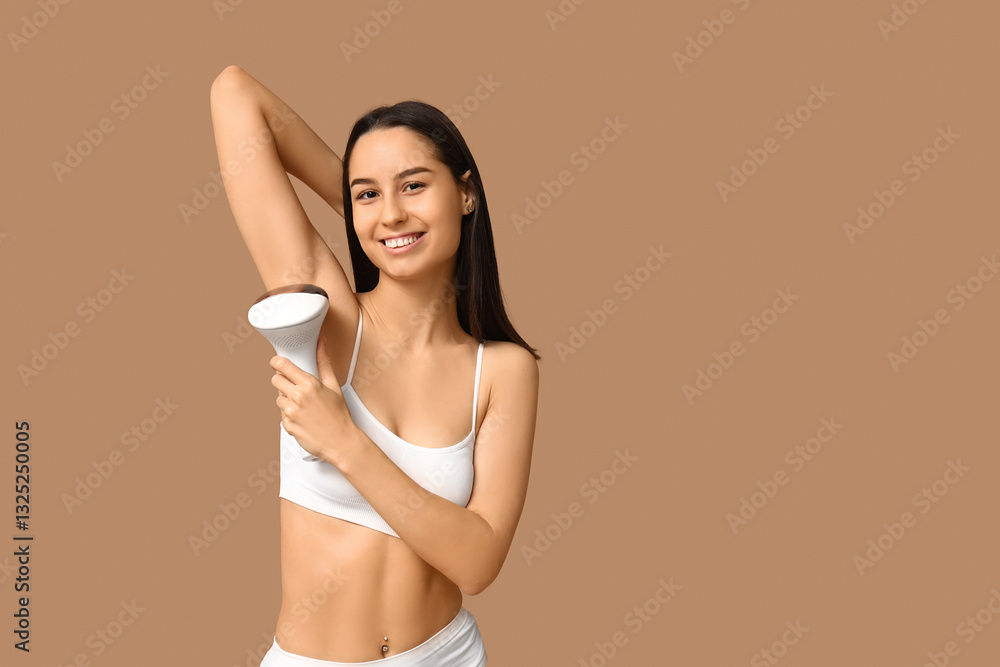 Happy young woman with modern photoepilator on brown background Happy young woman with modern photoepilator on brown background