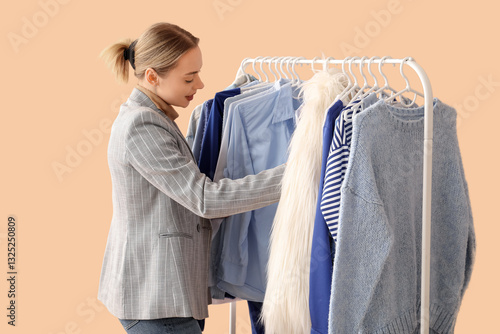 Female stylist with clothes...