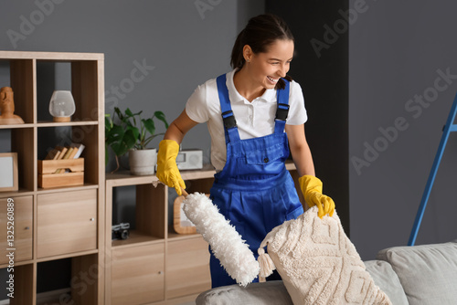Female janitor cleaning sof...