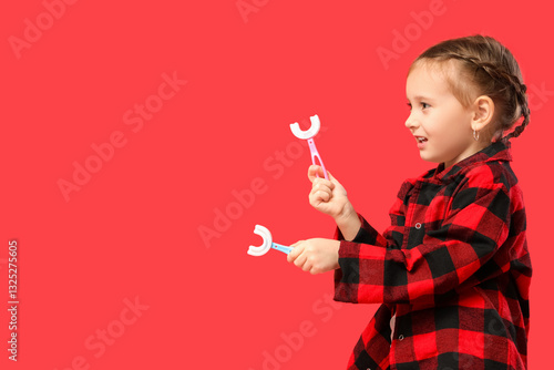 Happy little girl in checke...