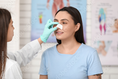 Plastic surgeon and young w...