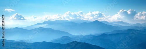 Wallpaper Mural Majestic Blue Mountain Range Under Bright Clouds with Soft Mist and Scenic Horizons for Nature and Landscape Photography Torontodigital.ca