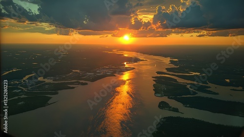 View from an airplane window flying over Louisiana, with the Mississippi Delta, swamps, and bayous visible below. The Gulf Coast glistens in the distance under a warm, humid sky.