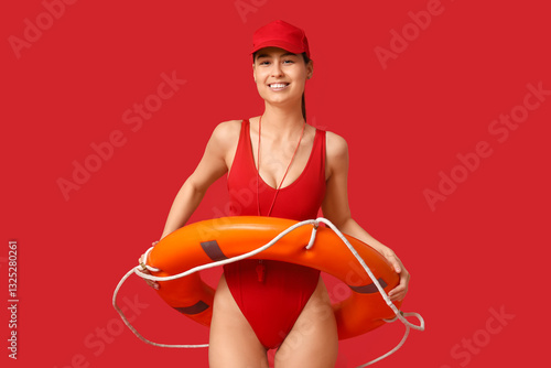 Female lifeguard with ring ...