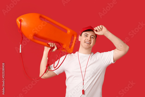 Male lifeguard with rescue ...