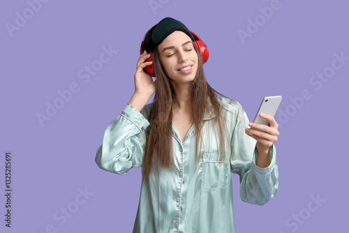 Young woman in pajamas and ...