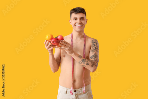 Young man with measuring ta...