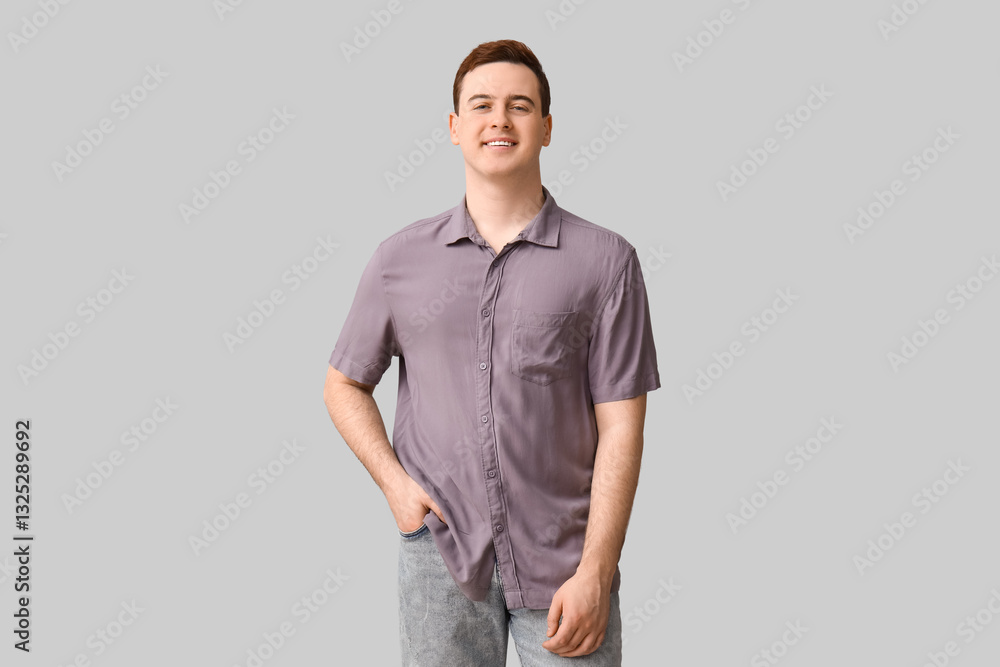 Fototapeta premium Handsome young man in stylish collar shirt on grey background