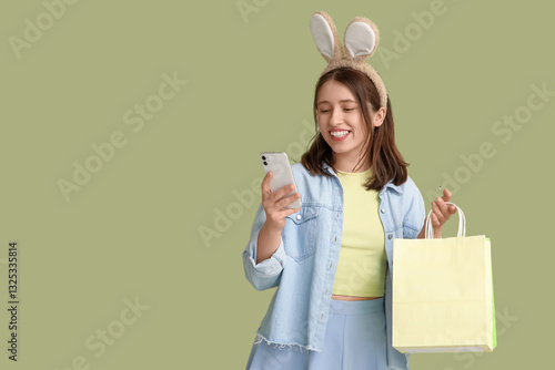 Young woman in bunny ears w...