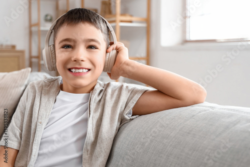 Little boy in headphones si...