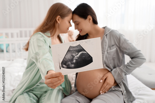 Young pregnant lesbian coup...