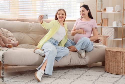 Young pregnant lesbian coup...