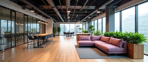 Obraz na płótnie spacious and modern office lounge featuring a cozy and comfortable sofa, expansive windows, high stools, and green plants, workspace organization theme w salonie