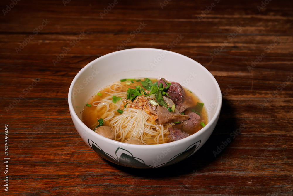 Savoring beef noodle soup local eatery food dish rustic setting close-up culinary delight Savoring beef noodle soup local eatery food dish rustic setting close-up culinary delight