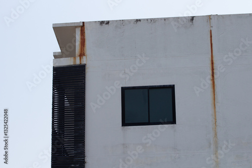 The old building has rust stains from long rains in Thailand.