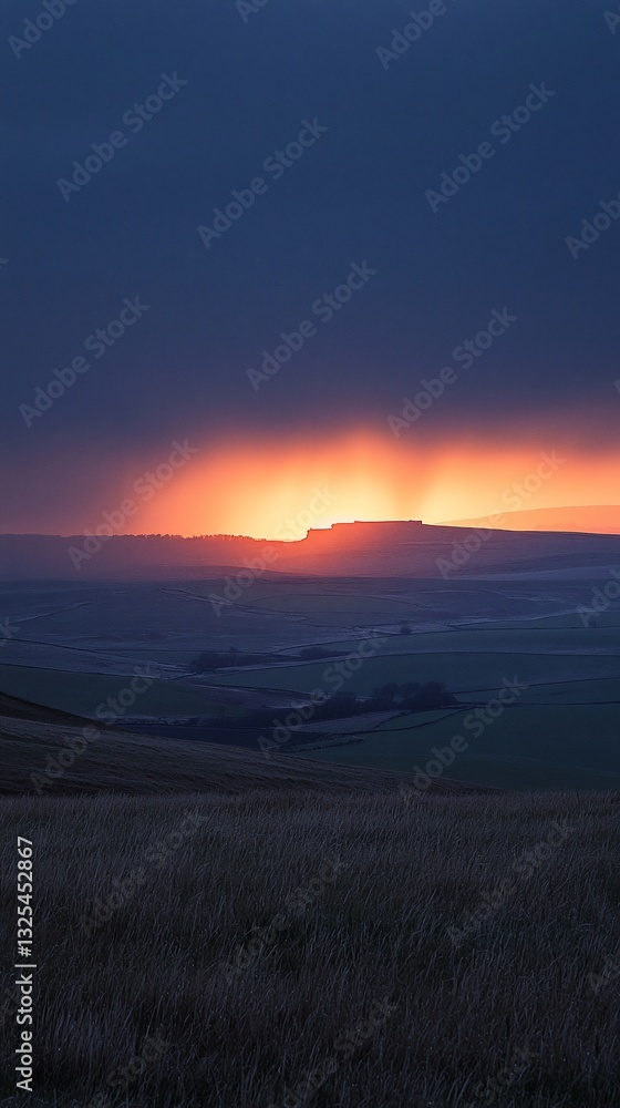 Fototapeta premium Dramatic sunset over a vast, flat landscape.